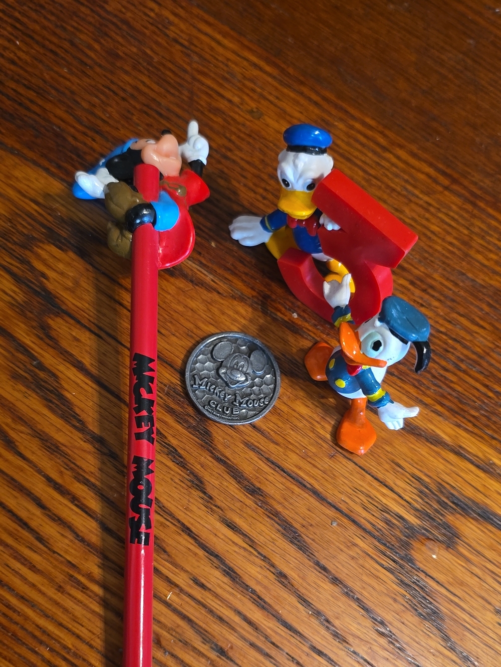 Source Unknown Red Pencil with Blue, Orange & White Disney Duck Figures